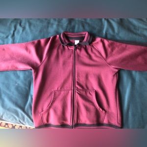 From Old Navy.Black and red stripes on the collar,wrists and the bottom.